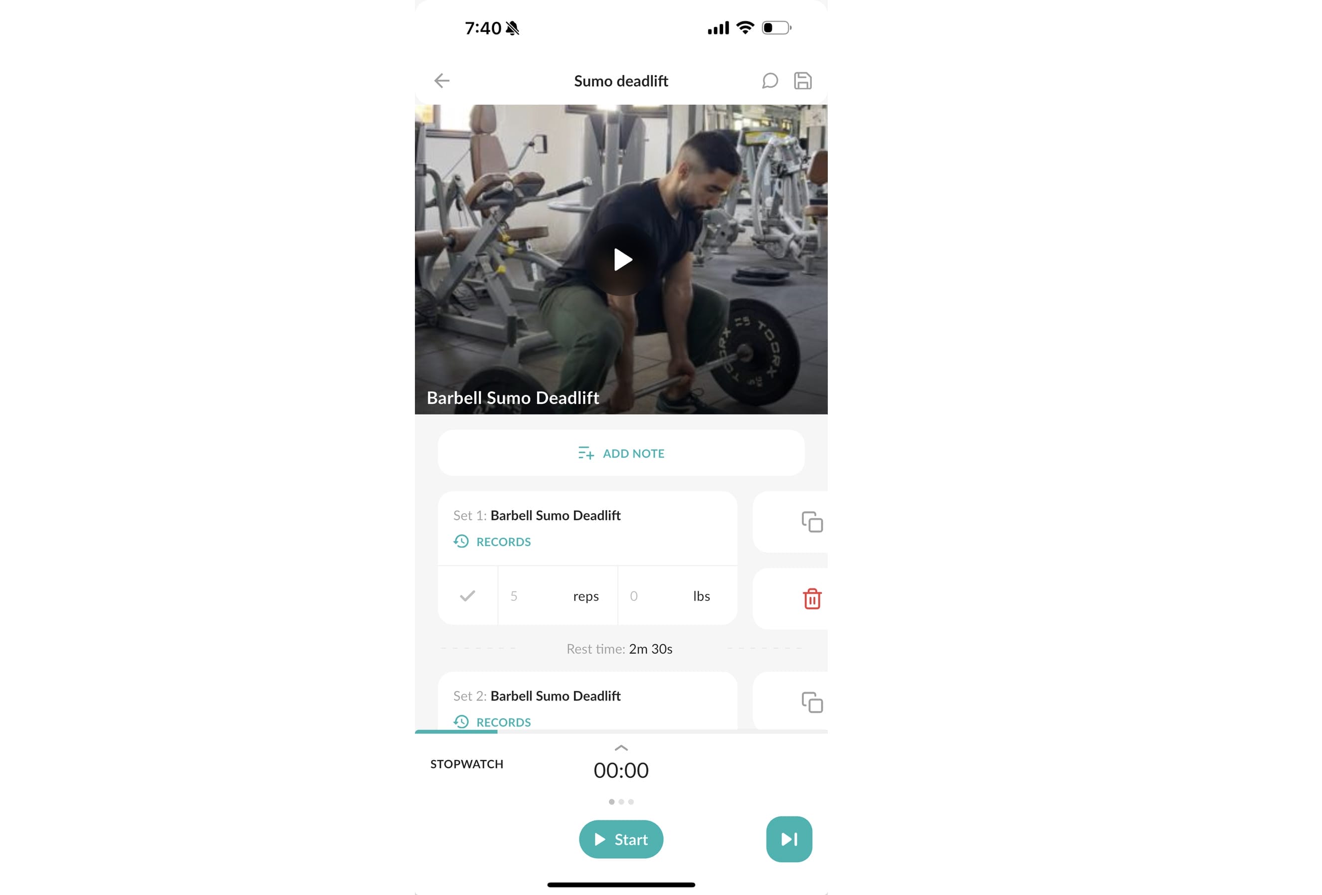 The image shows a mobile app interface displaying a video tutorial for a "Barbell Sumo Deadlift." A man in gym attire demonstrates the exercise in a gym setting. Below the video are records and input fields for sets, reps, and weight, plus a timer and start button for tracking.